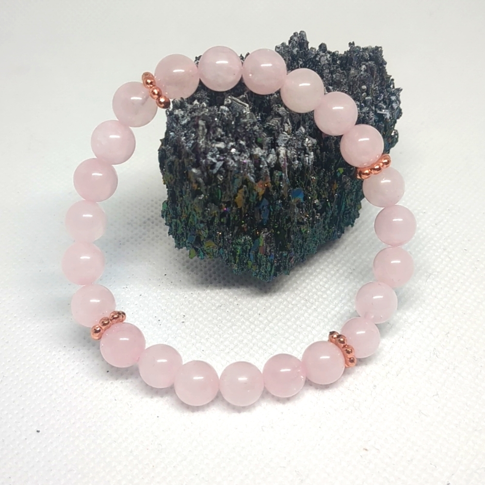 Rose quartz bracelet with copper daisy spacer beads